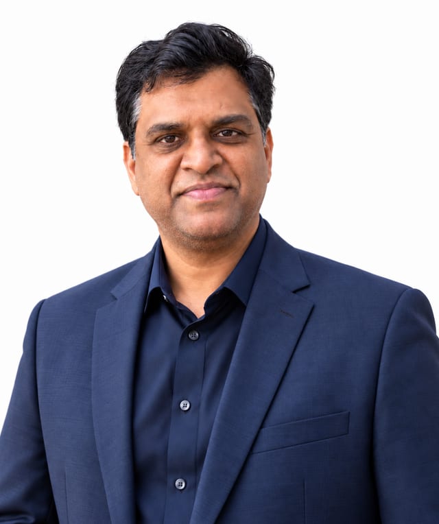 Chak Karri, Founder and Broker of Record at Navira Property Management, in a navy suit